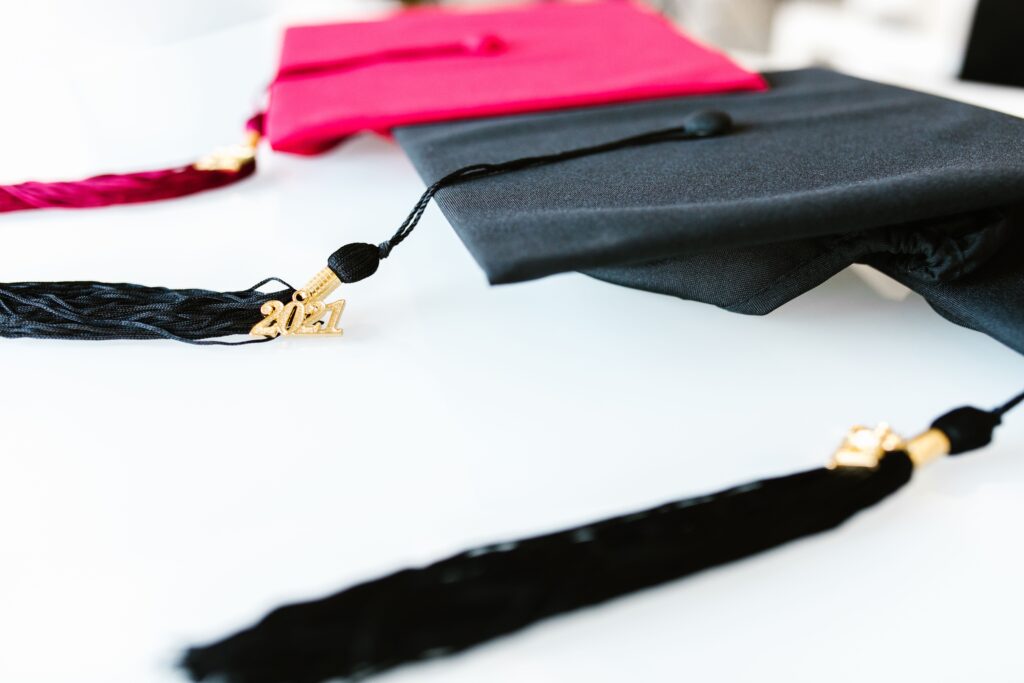 College Know-how Graduation caps with tassels marked 2021, symbolizing academic achievement.